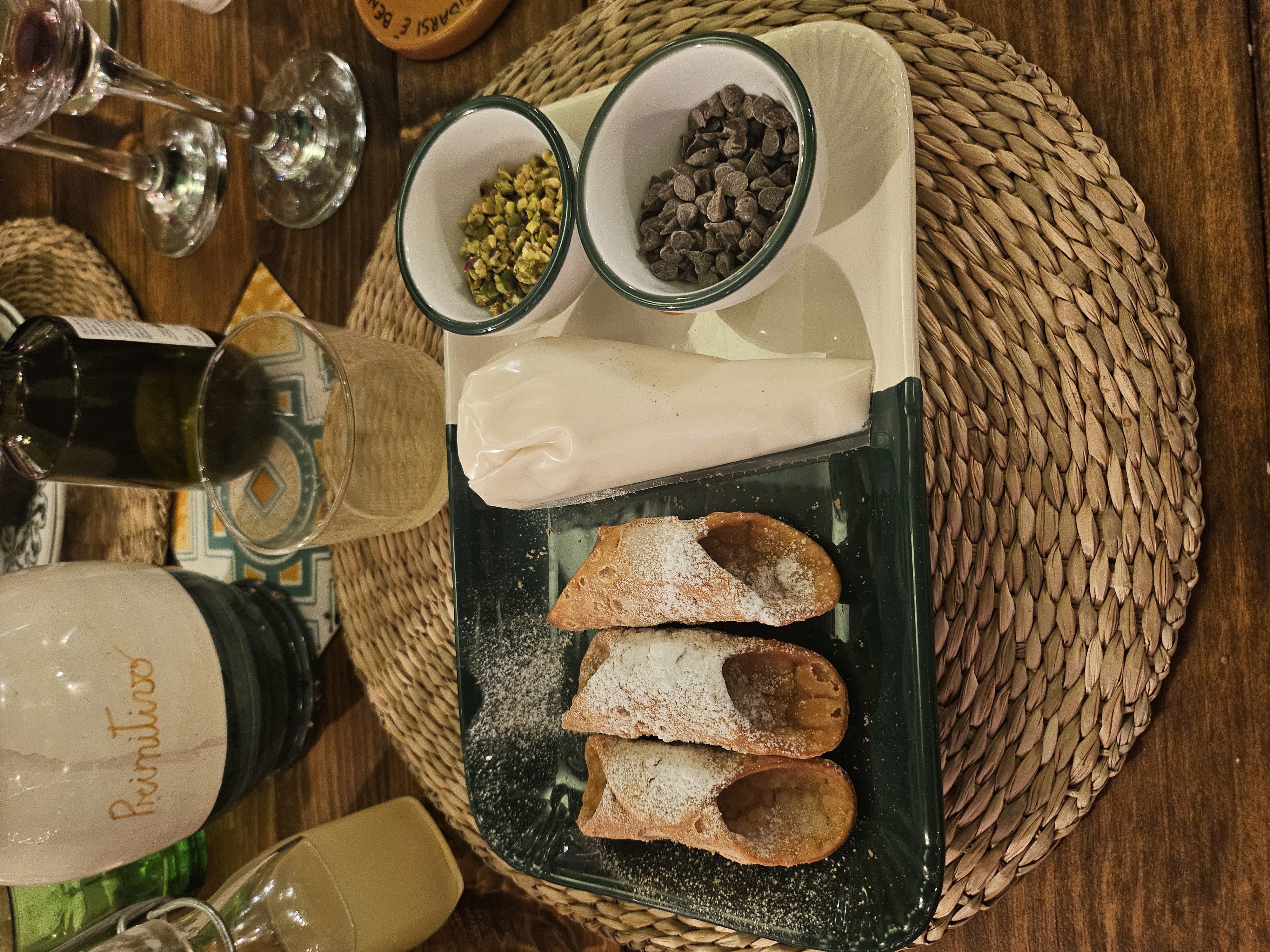 Interactive DIY cannelloni dessert spread with ricotta cream and chopped pistachios