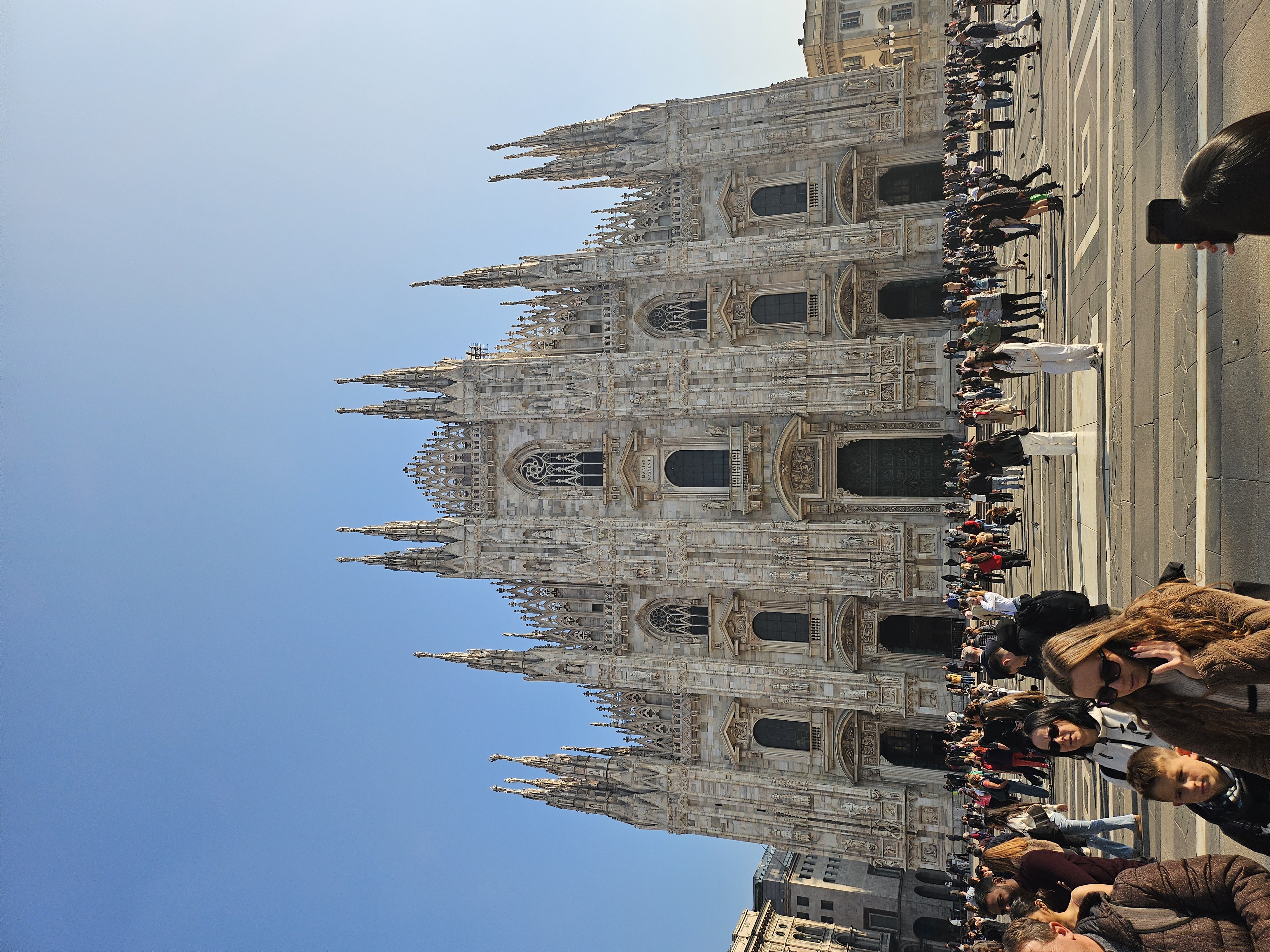 Duomo di Milano cathedral facade and intricate Gothic spires in afternoon light
