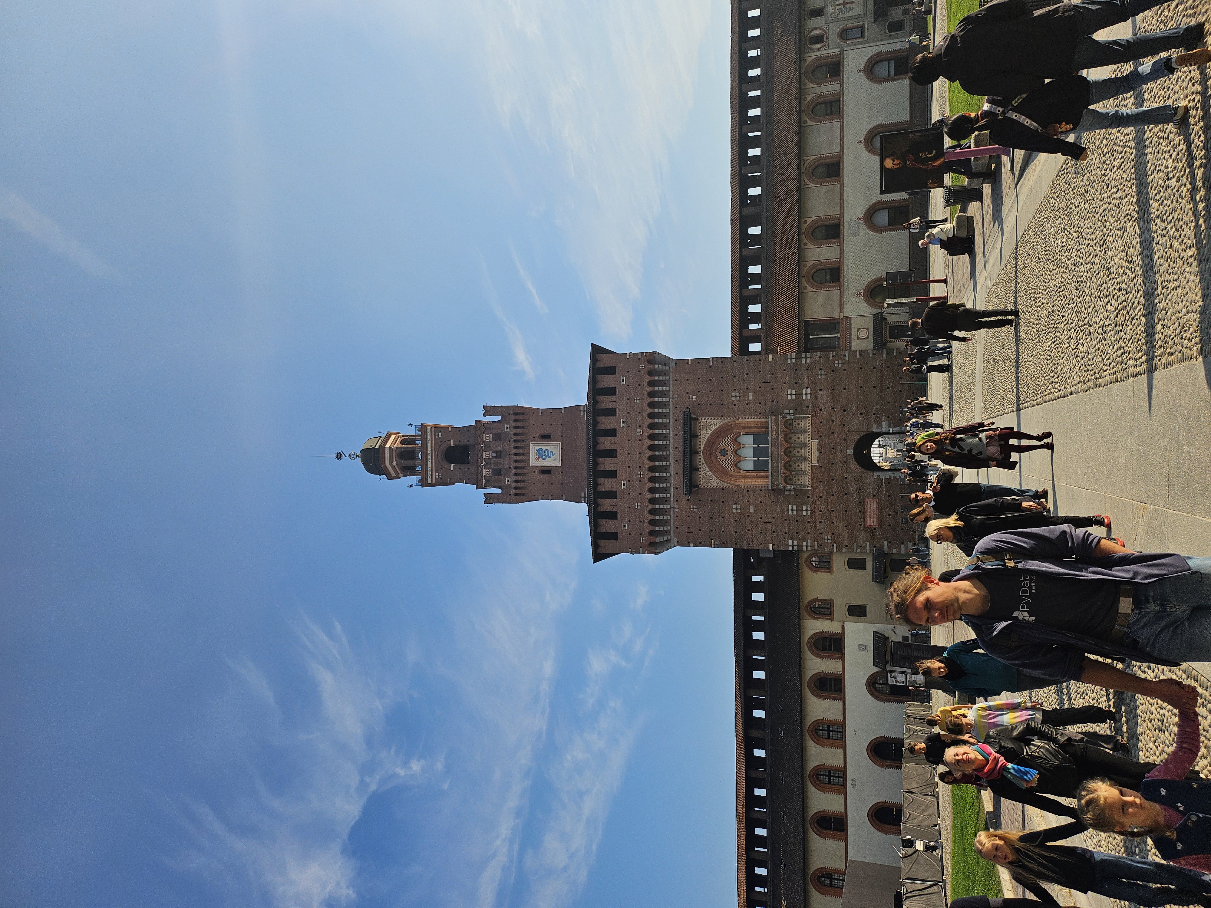 Imposing red-brick fortress tower and courtyards of Castello Sforzesco