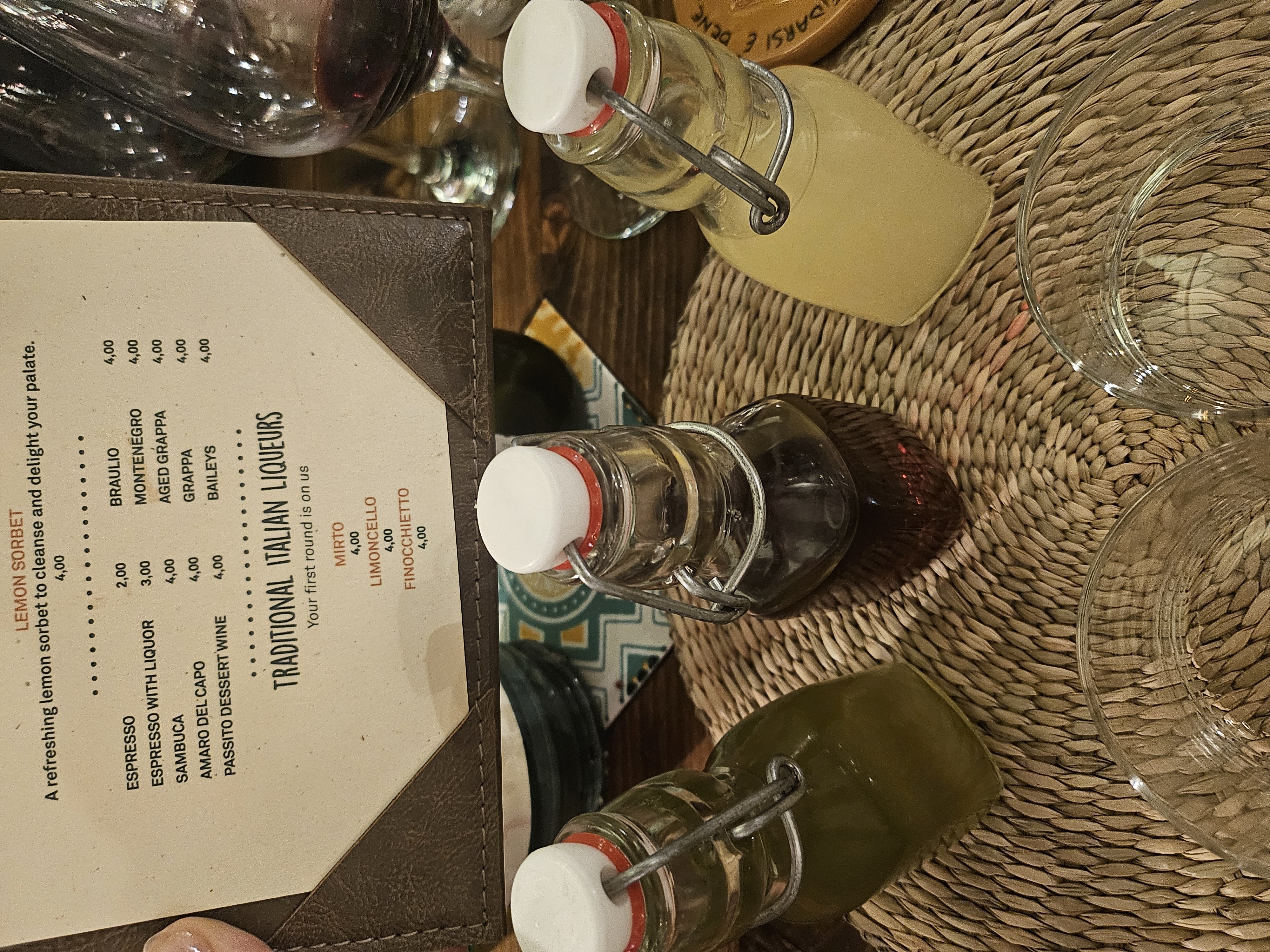 Generous complimentary 400ml bottles of local Italian digestifs on the table