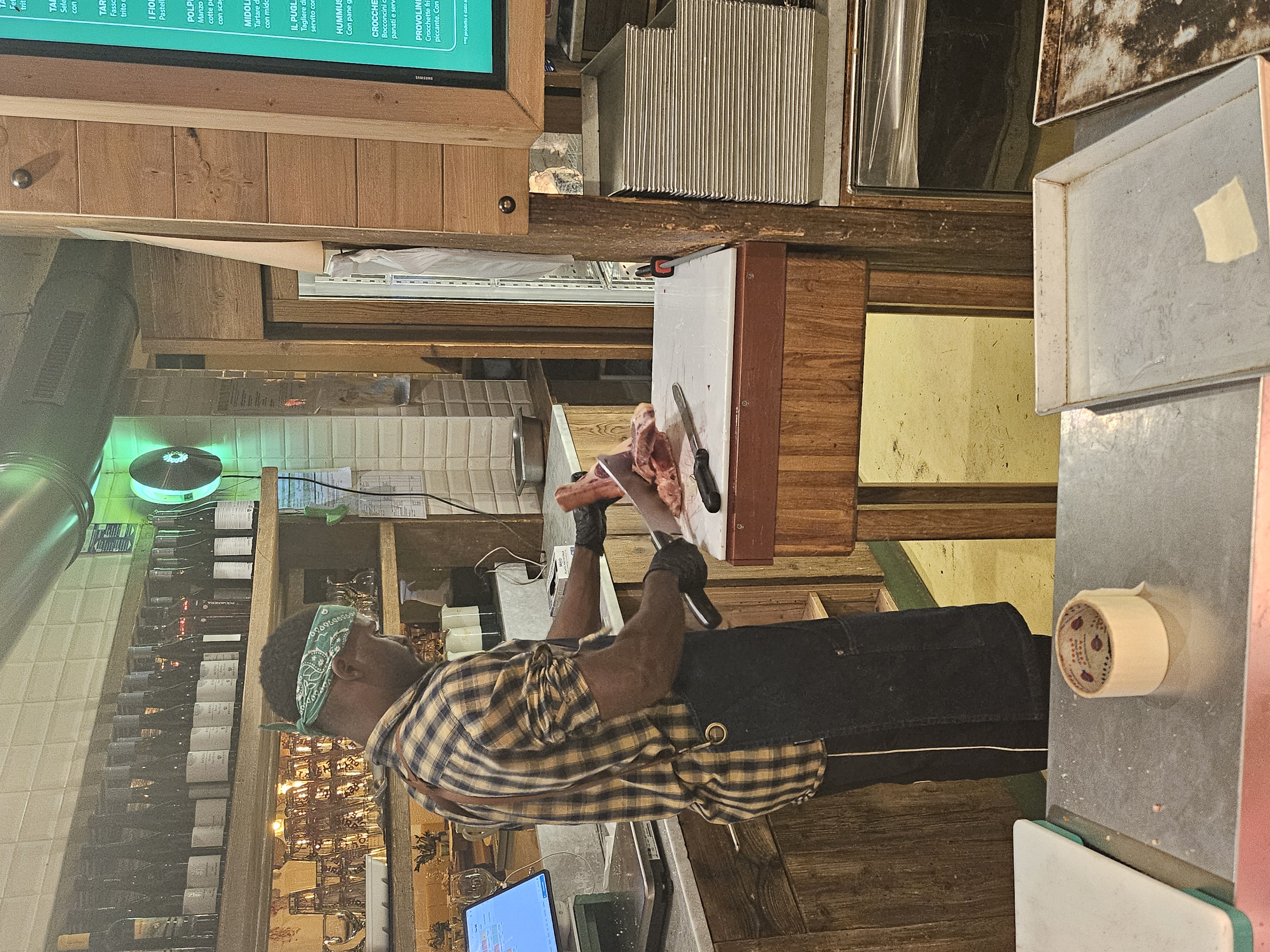Butcher counter display and dining room inside Il Mannarino in Navigli