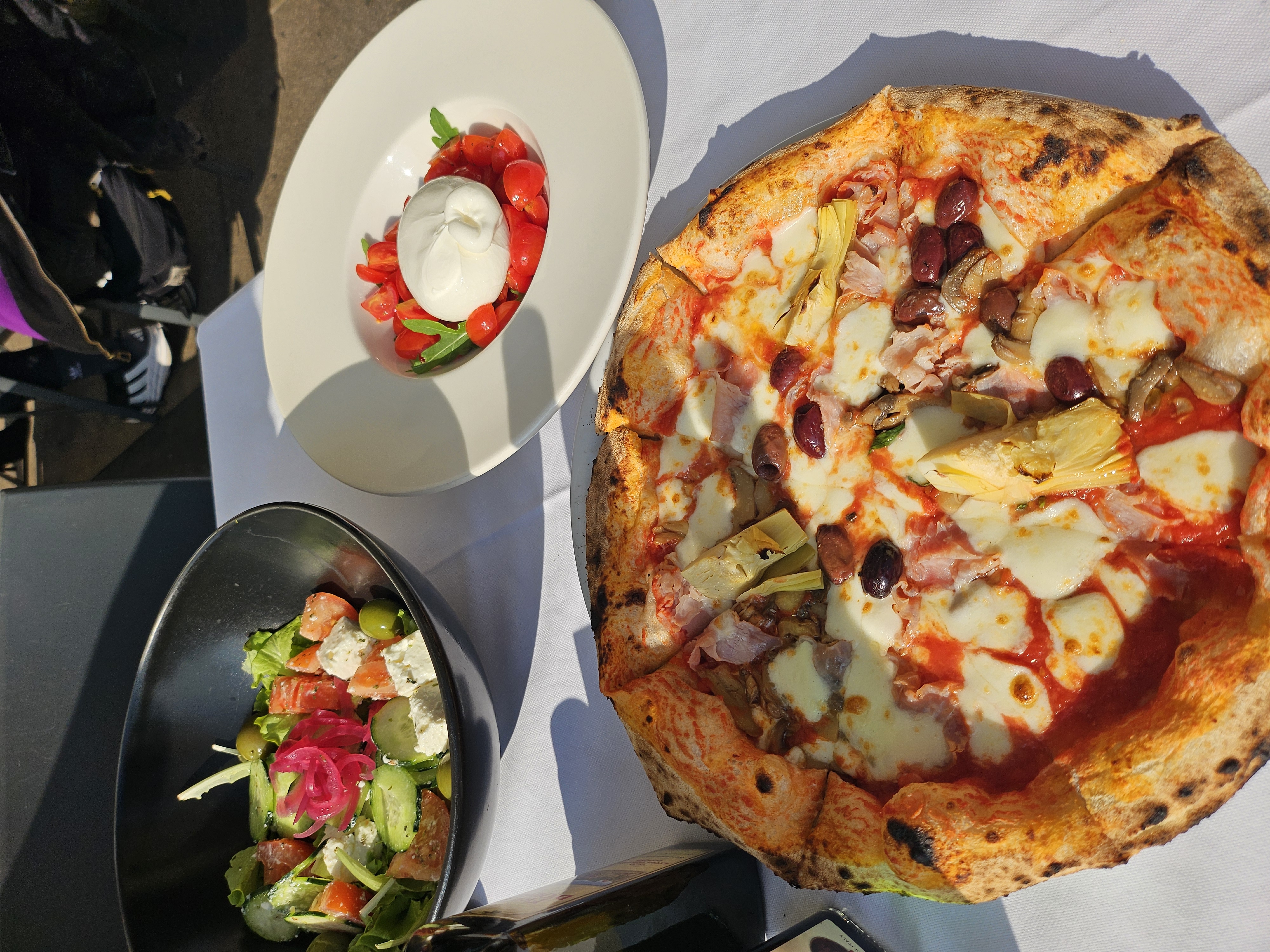 Crispy thin-crust Italian pizza enjoyed on an al fresco terrace near the Duomo